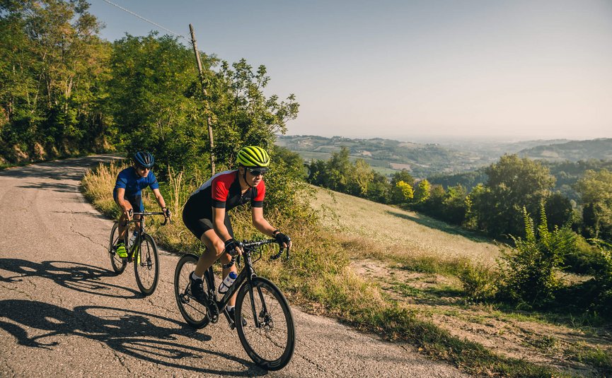 Road bike holidays on the Adriatic coast © Alex Moling Two cyclists riding on a country road through hilly countryside.