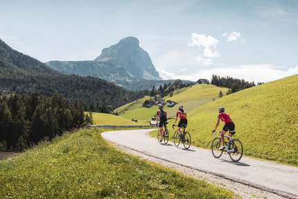 Furkelpass © Alex Moling Three cyclists riding on a mountain road with alpine scenery